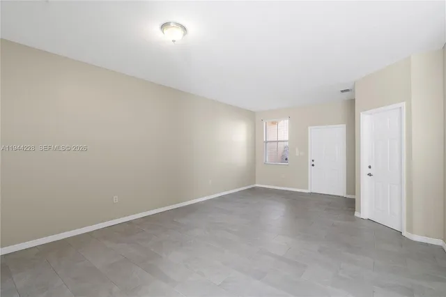 a view of an empty room and window