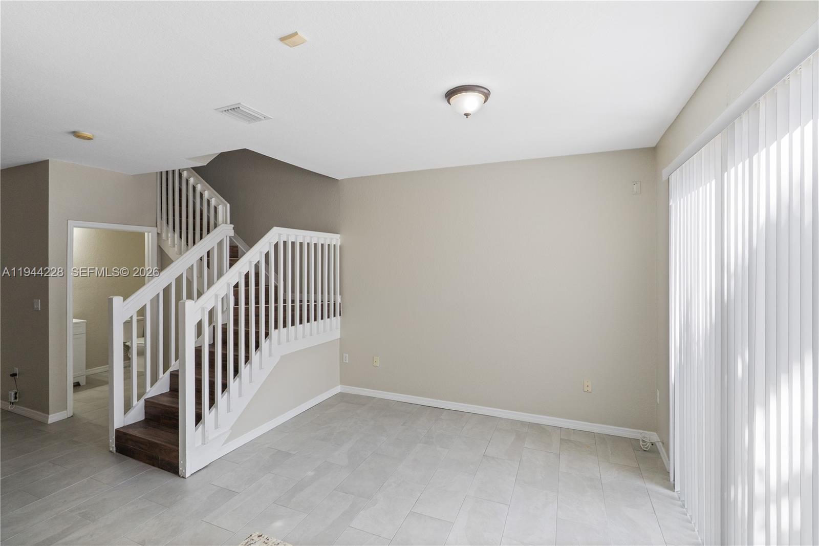12476 Southwest 122nd Street Miami, FL 33186 - Photo 7 of 18 a view interior of a house with stairs