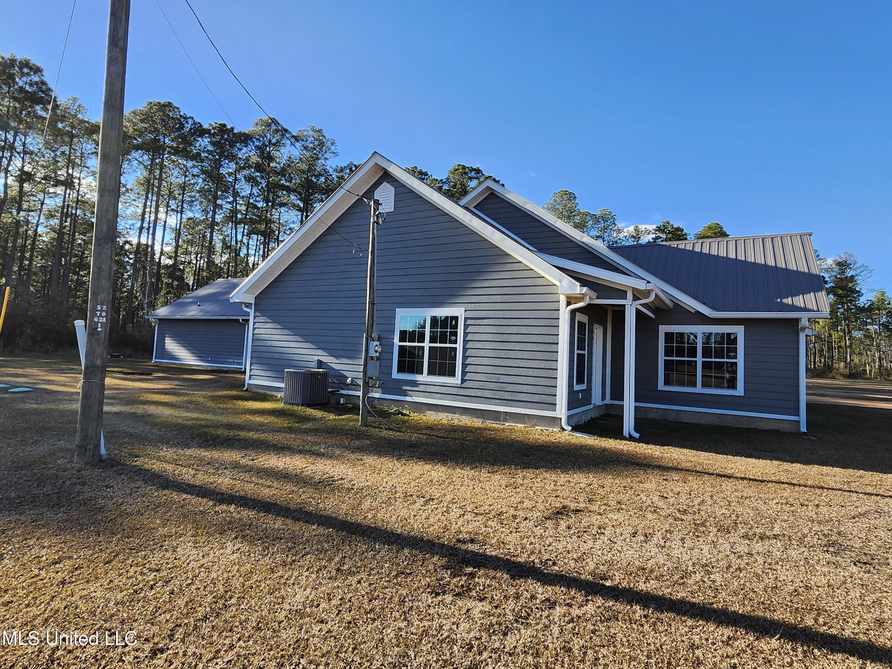 196 West McHenry Road Perkinston, MS 39573 - Photo 3 of 15 Side