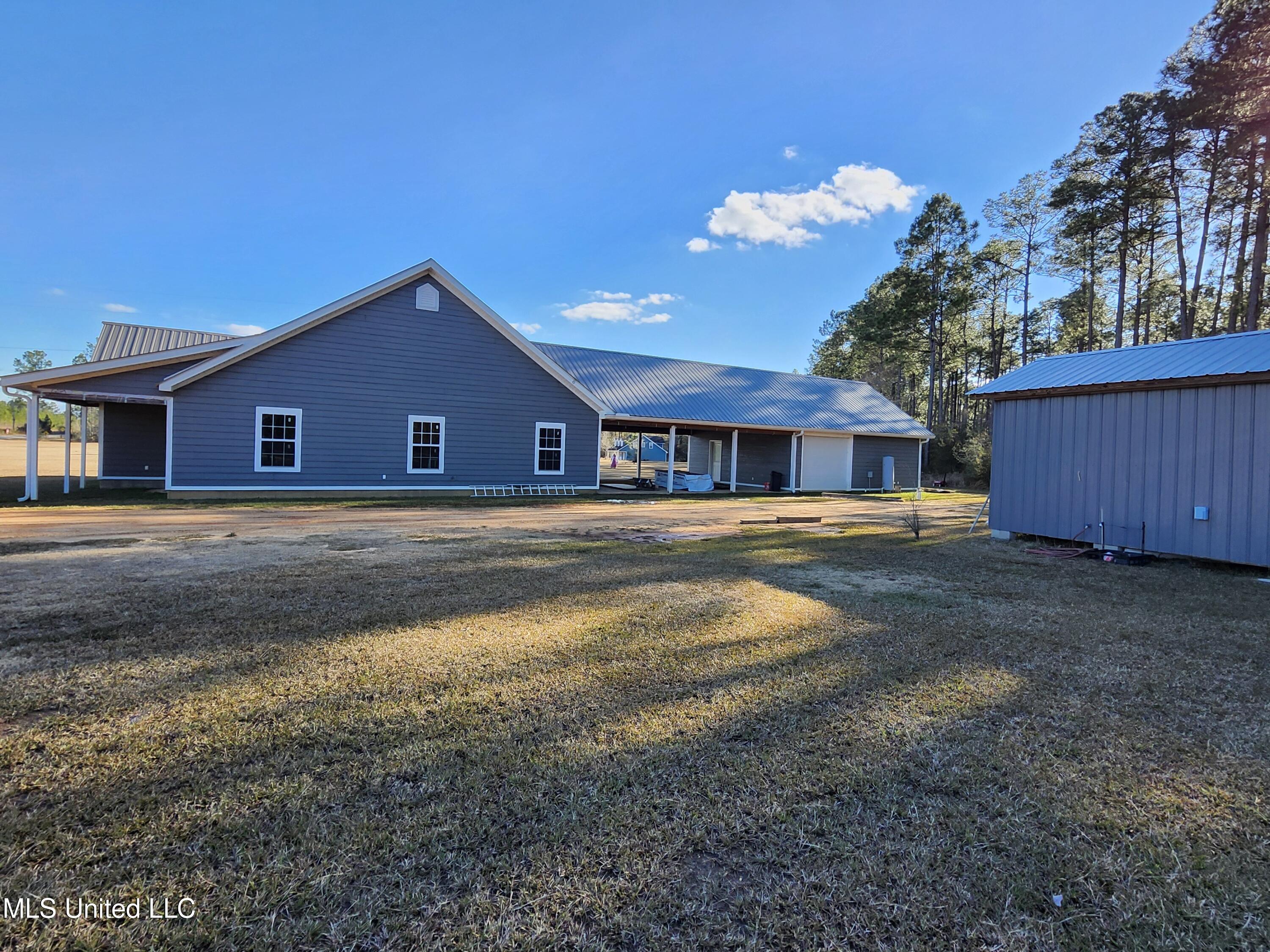 196 West McHenry Road Perkinston, MS 39573 - Photo 4 of 15 Side