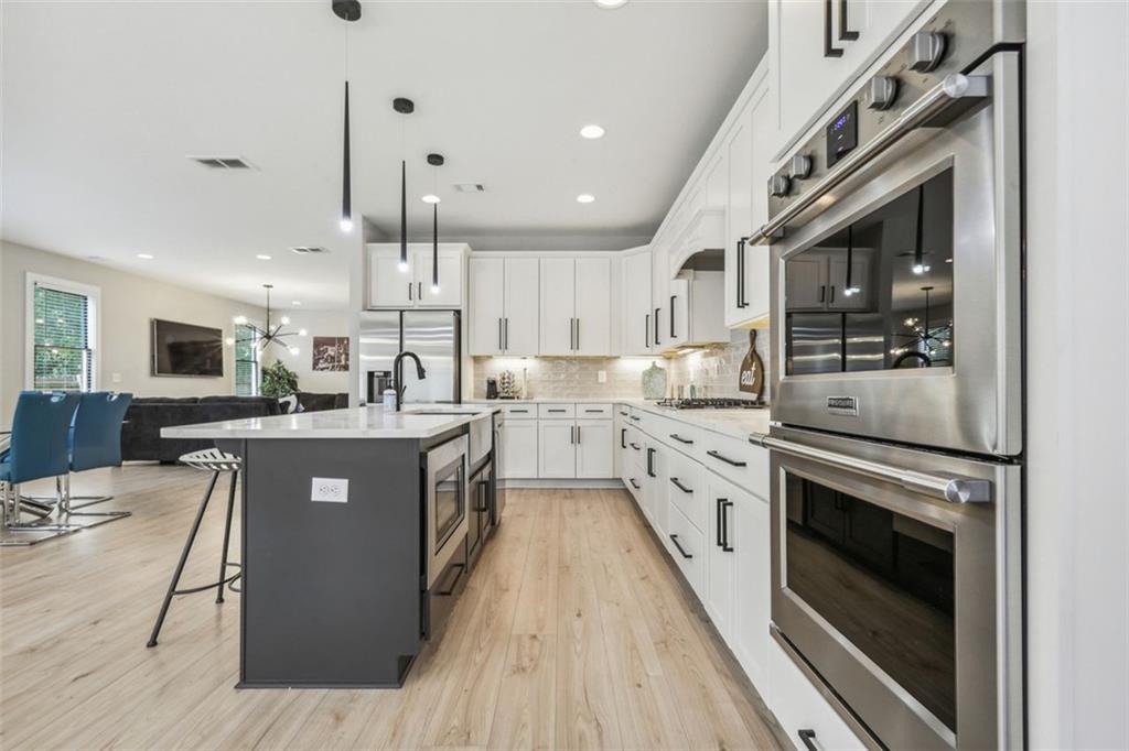 2145 Park Terrace Atlanta, GA 30337 - Photo 5 of 24 a large kitchen with stainless steel appliances granite countertop lots of counter top space a sink and cabinets