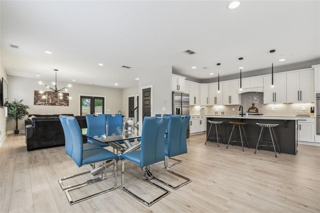 2145 Park Terrace Atlanta, GA 30337 - Photo 6 of 24 a kitchen with stainless steel appliances kitchen island granite countertop a sink and a refrigerator
