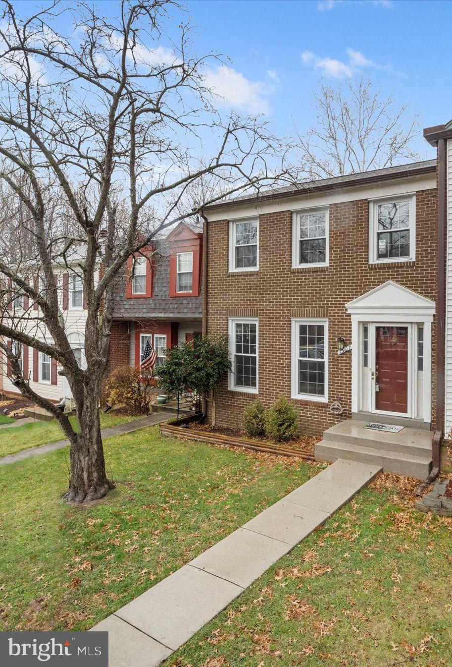 7907 Forest Path Way Springfield, VA 22153 - Photo 1 of 34 a front view of a house with garden