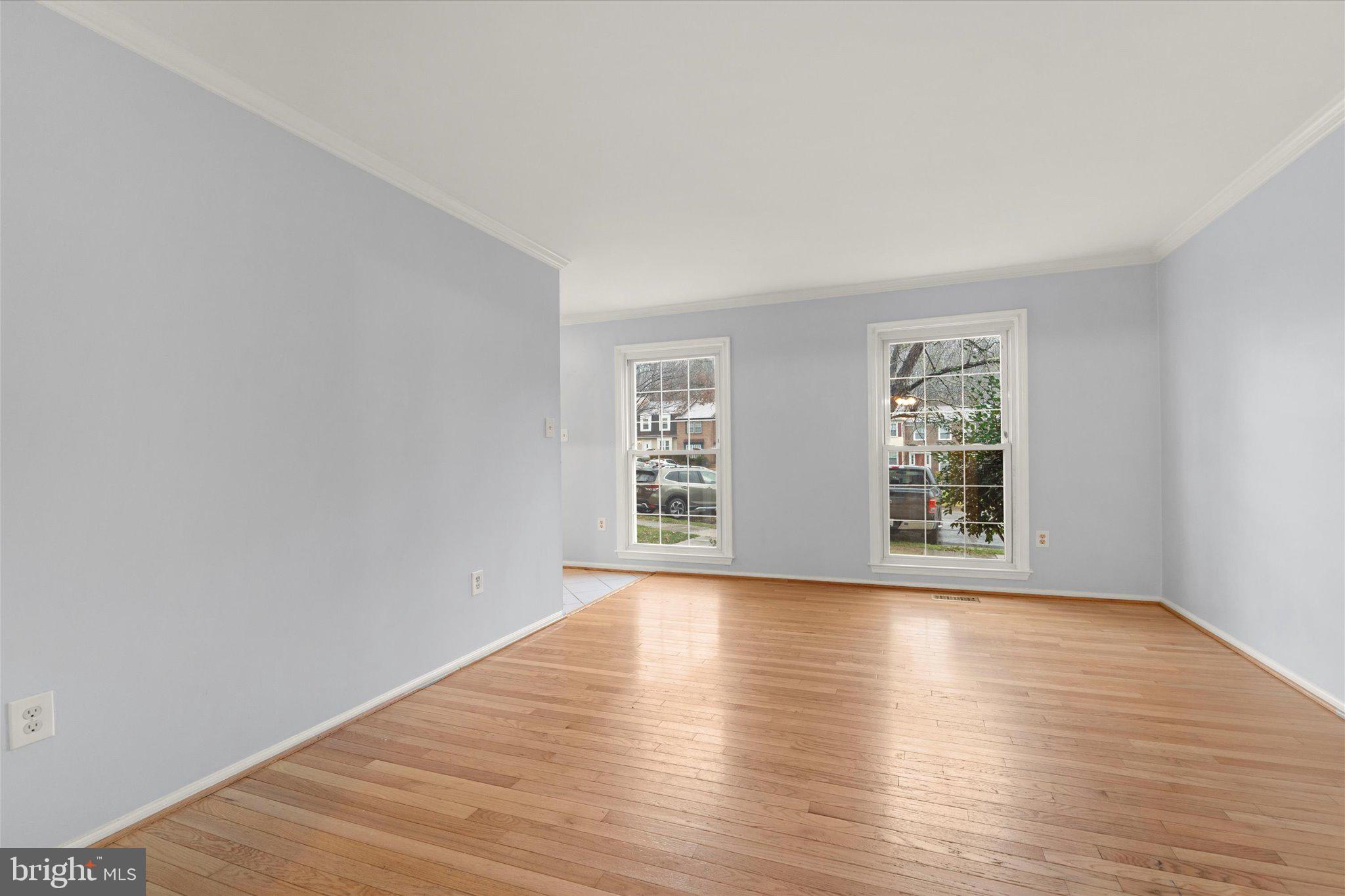 7907 Forest Path Way Springfield, VA 22153 - Photo 11 of 34 a view of a big room with wooden floor and windows