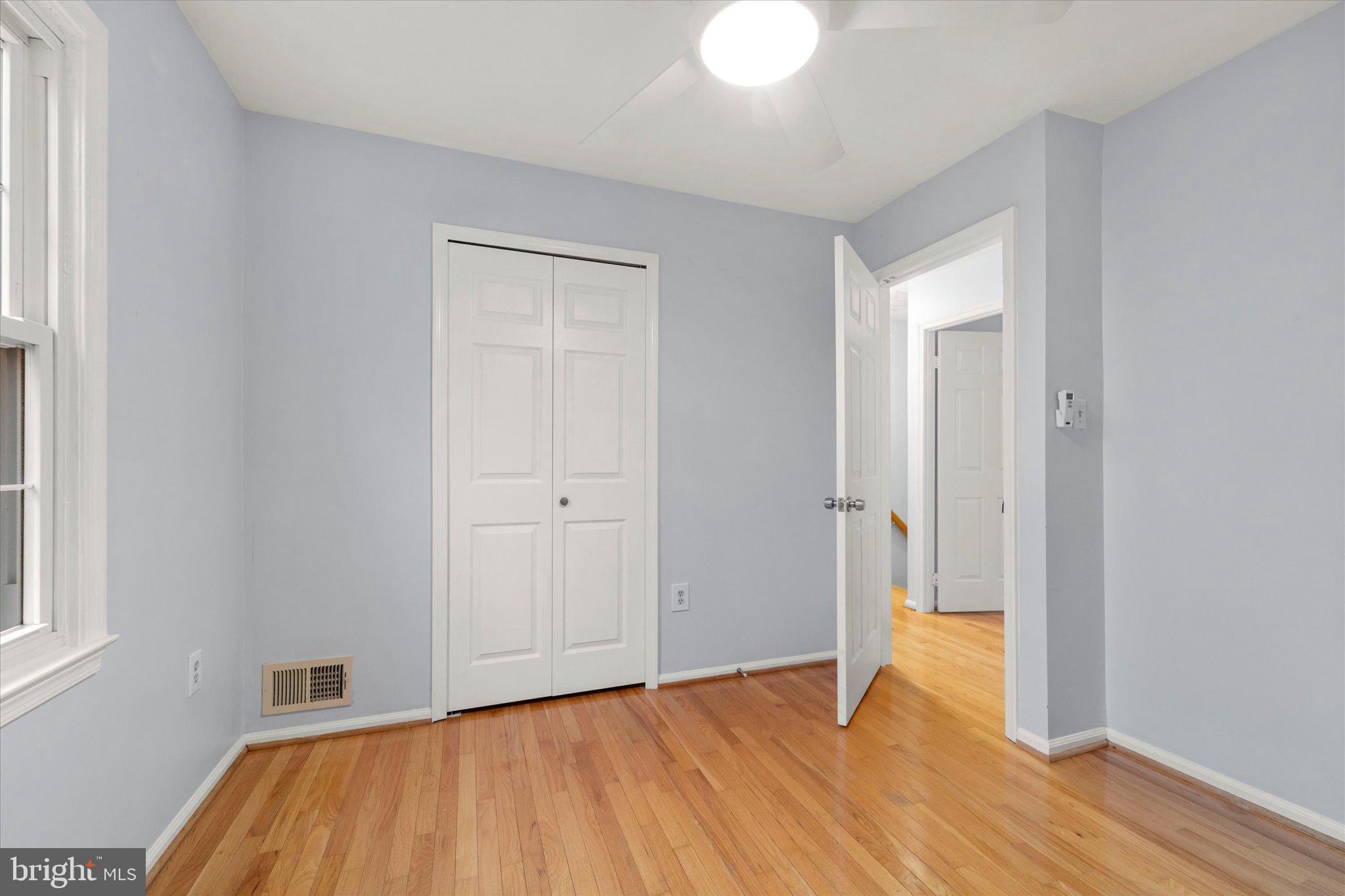 7907 Forest Path Way Springfield, VA 22153 - Photo 20 of 34 a view of empty room with wooden floor