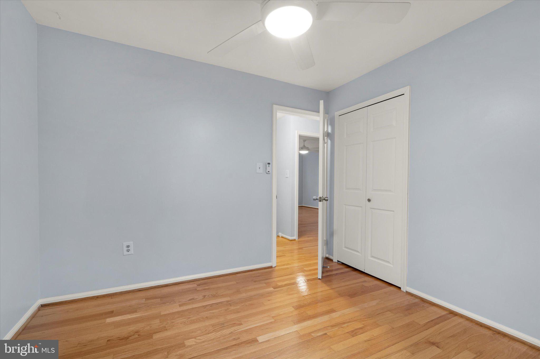7907 Forest Path Way Springfield, VA 22153 - Photo 22 of 34 a view of an empty room and wooden floor