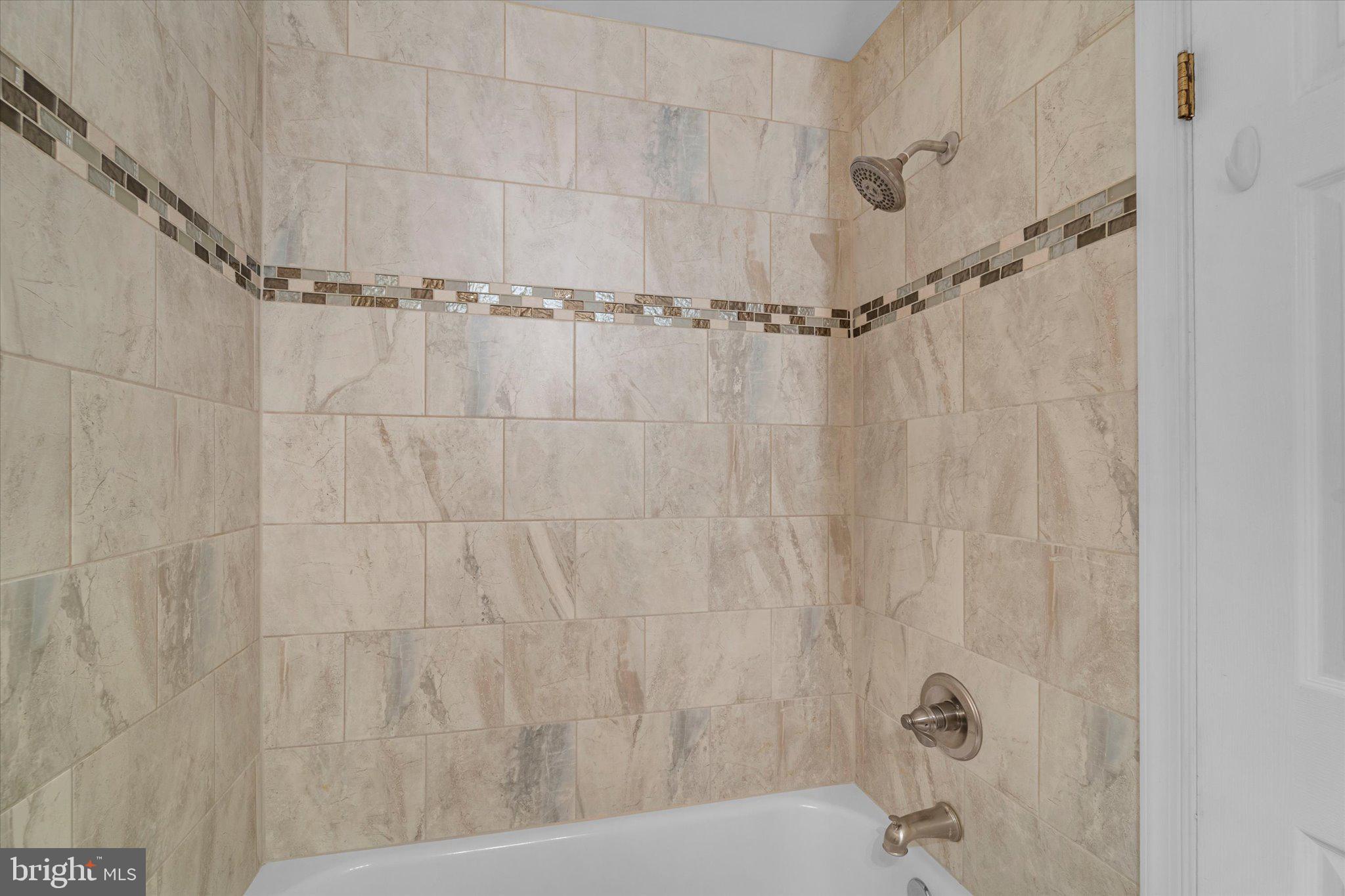 7907 Forest Path Way Springfield, VA 22153 - Photo 24 of 34 a bathroom with a shower