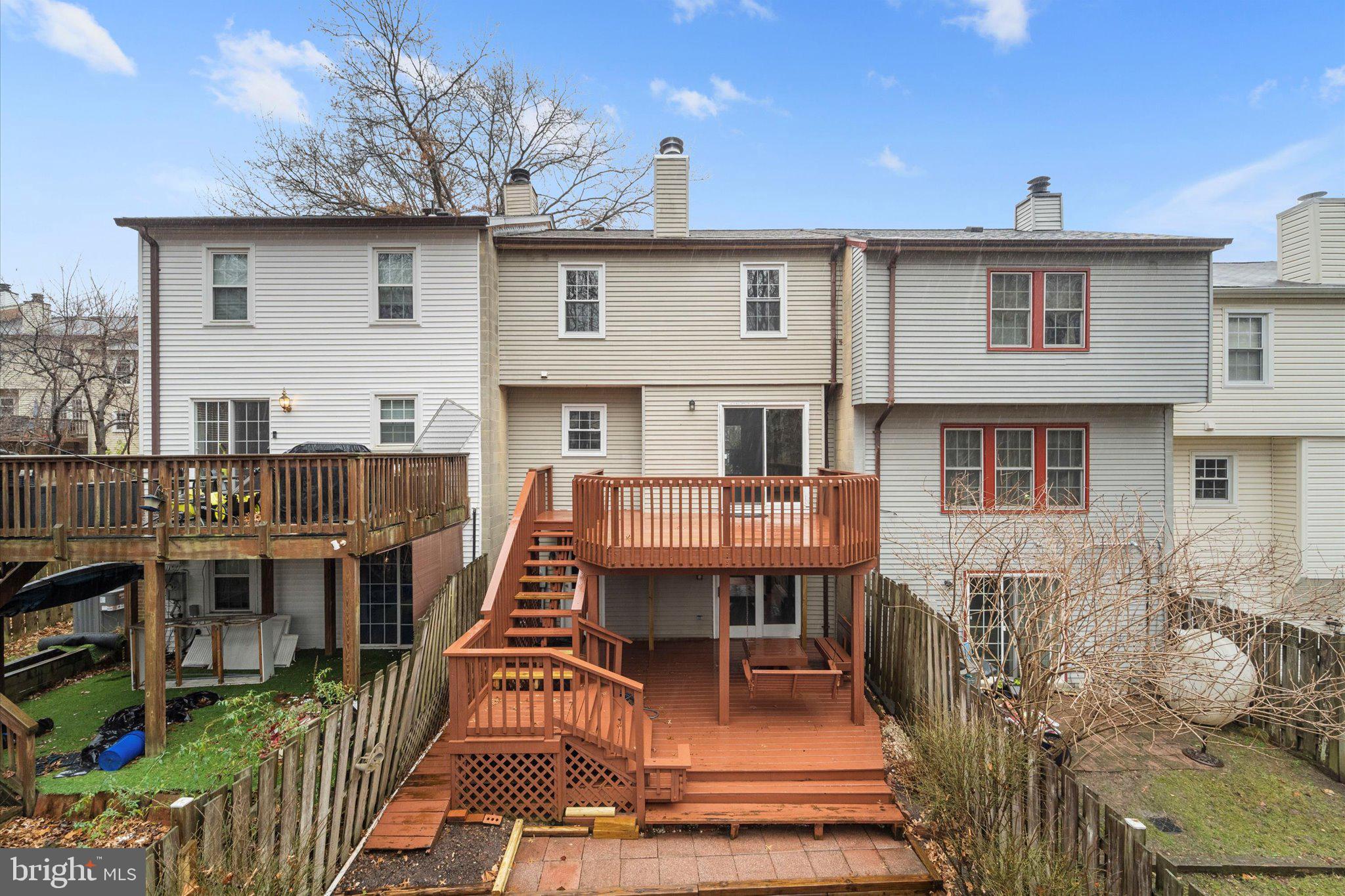 7907 Forest Path Way Springfield, VA 22153 - Photo 29 of 34 a view of a house with wooden deck