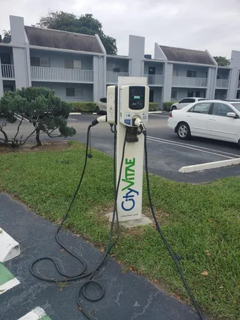 a view of a backyard with table and chairs