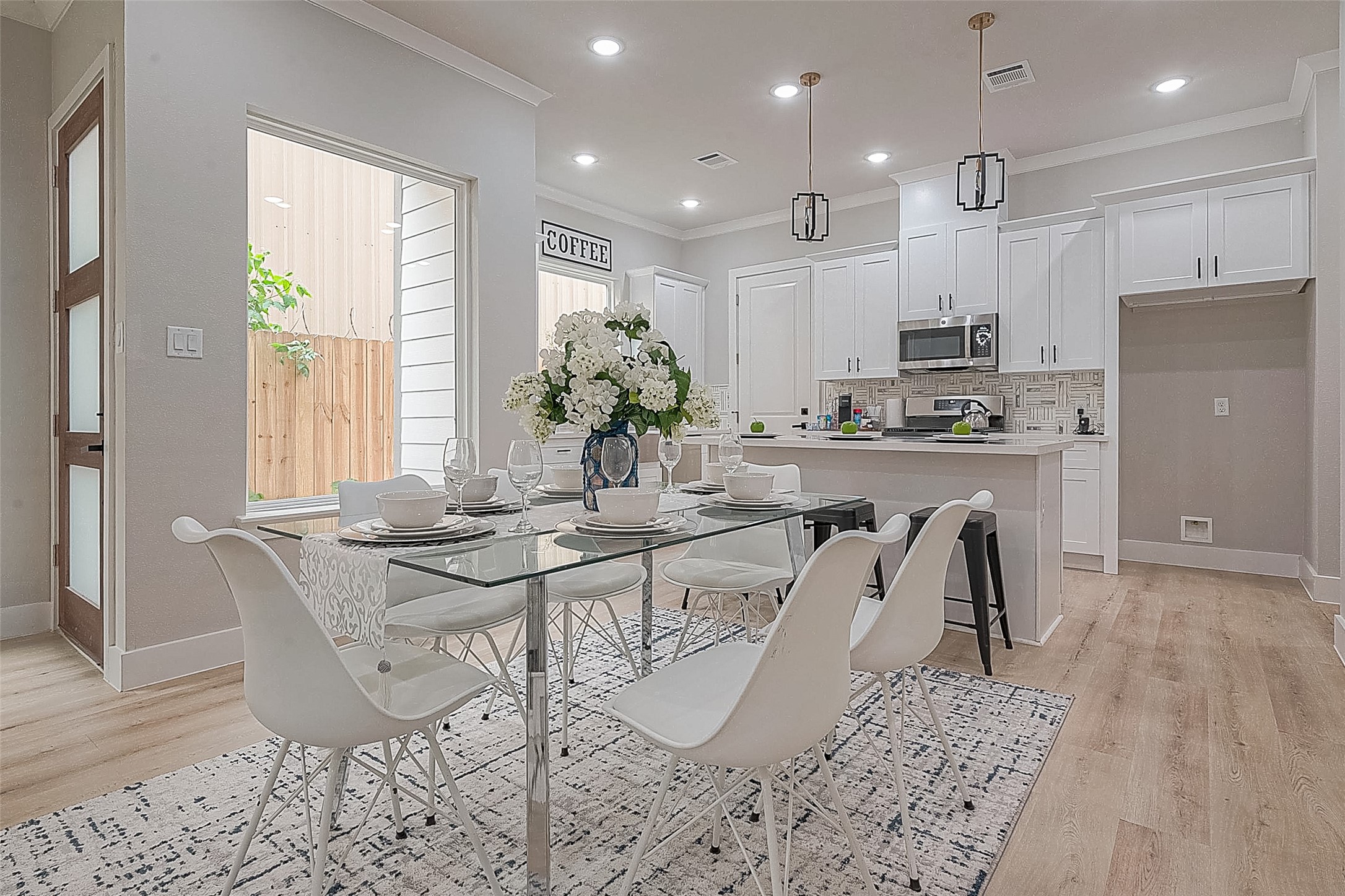 3837 Mainer Street Houston, TX 77021 - Photo 9 of 19 a view of a dining room with furniture and wooden floor