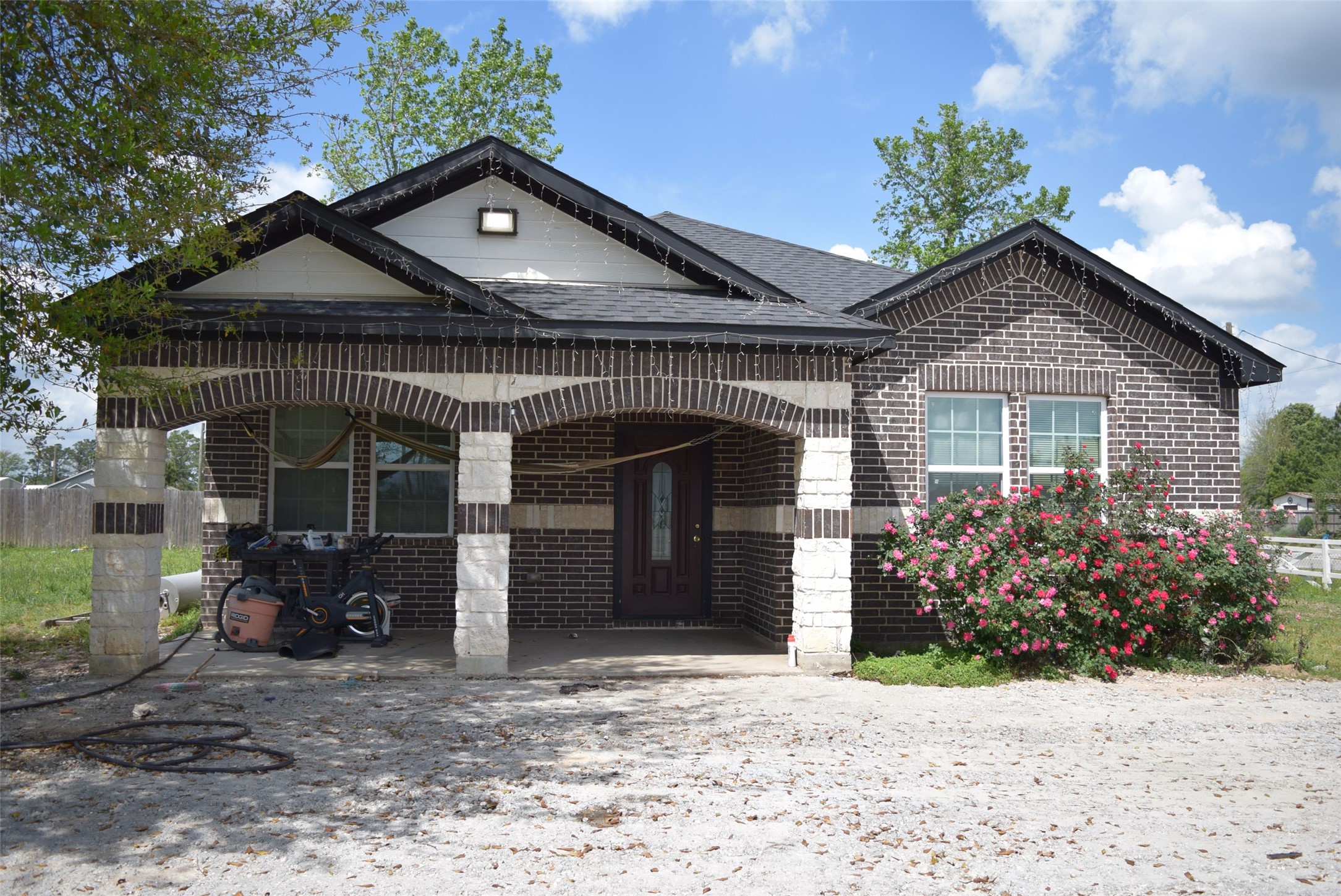a front view of a house with garden