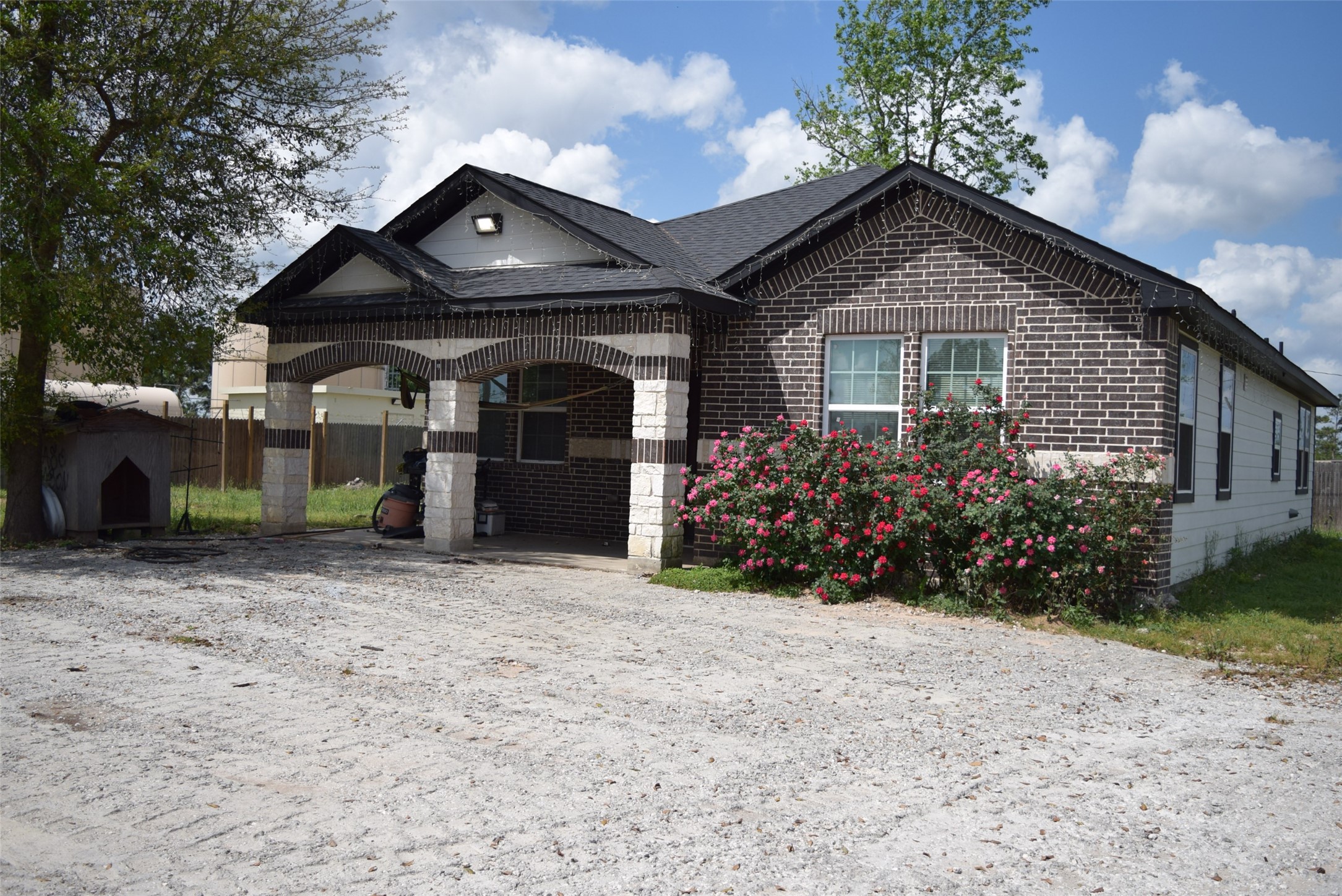 445 Road 5102 Cleveland, TX 77327 - Photo 3 of 36 a front view of a house with a yard and garage