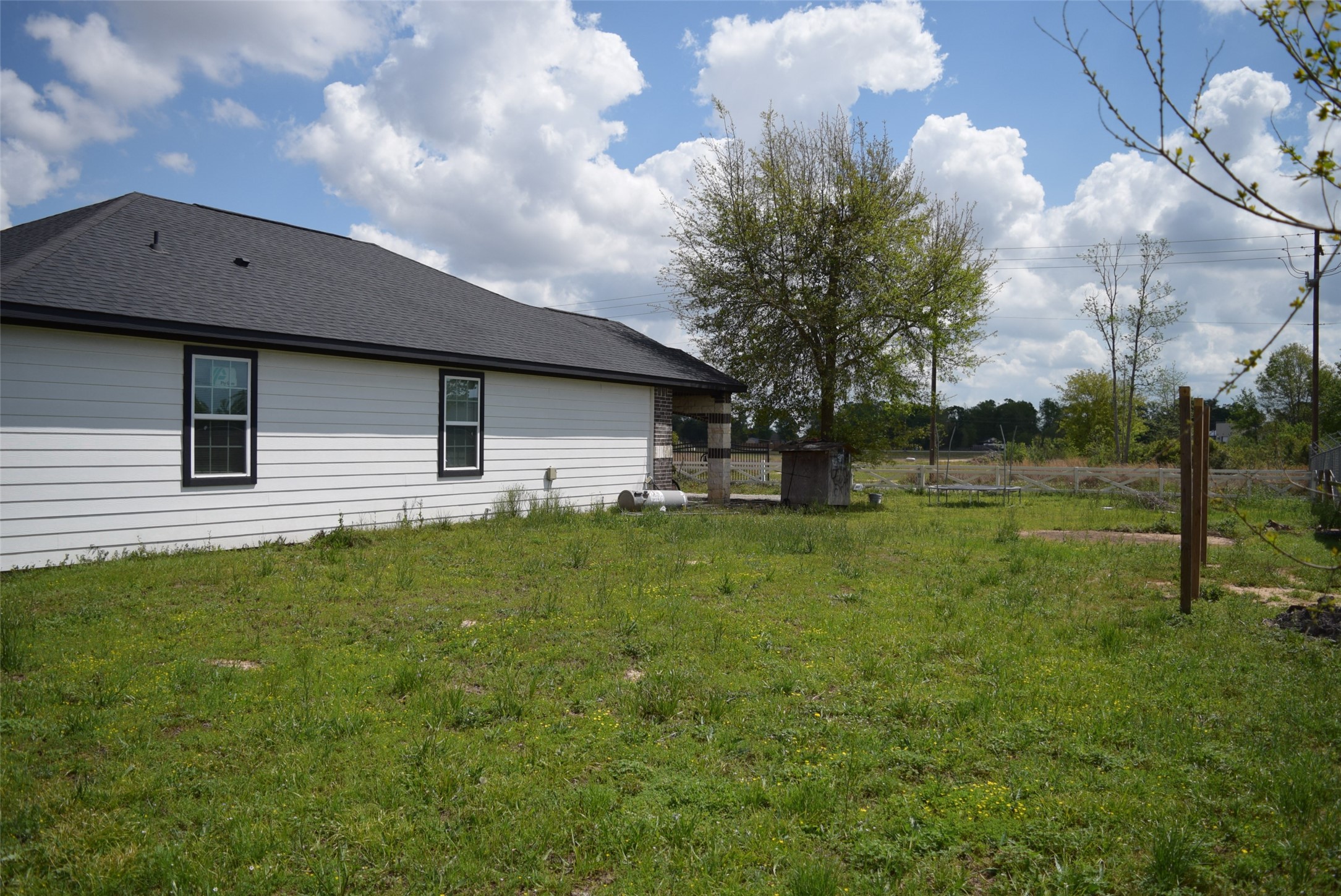 445 Road 5102 Cleveland, TX 77327 - Photo 34 of 36 a view of a house with backyard