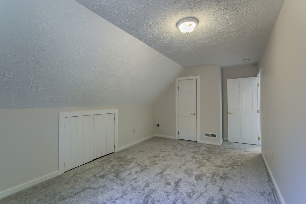 773 Moore Hill Road Athol, MA 01331 - Photo 17 of 30 an empty room with fan & view of bathroom