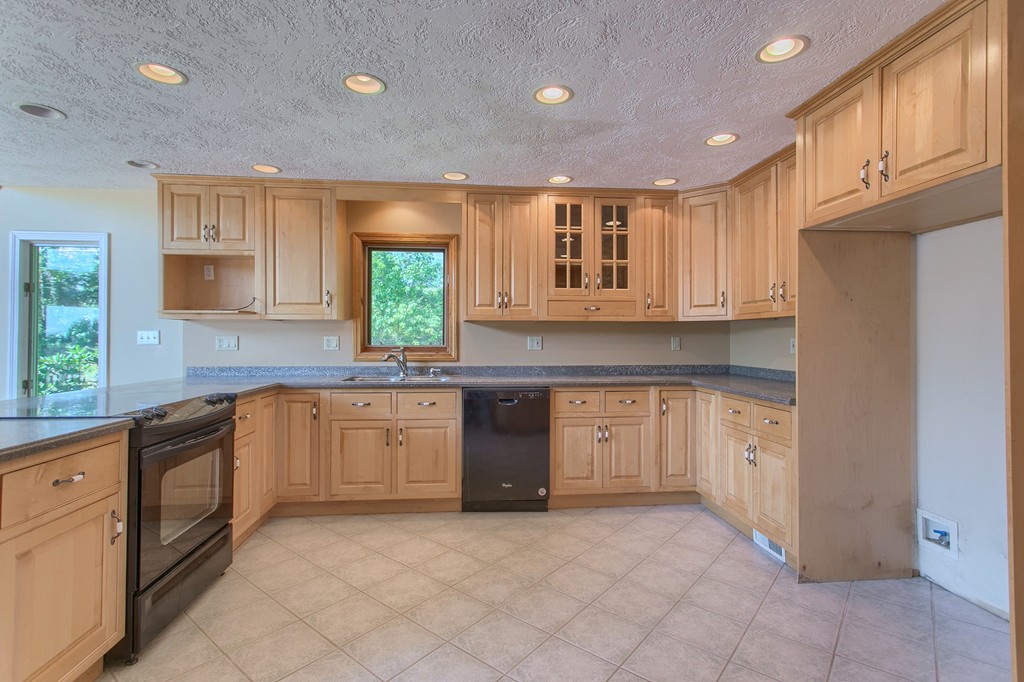 773 Moore Hill Road Athol, MA 01331 - Photo 5 of 30 a kitchen with granite countertop cabinets stainless steel appliances a sink and a window