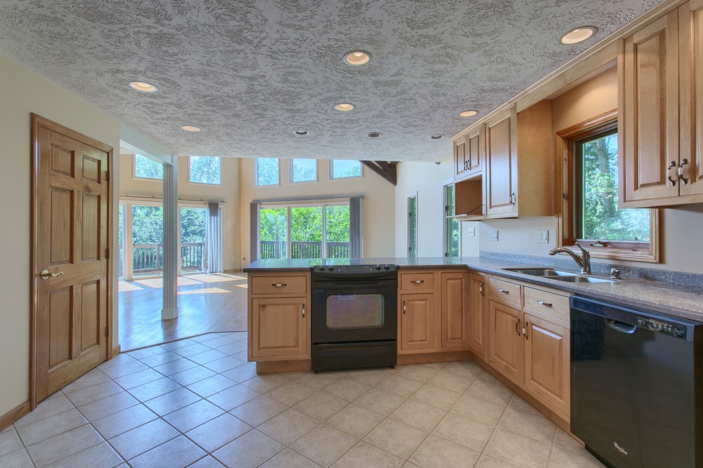 773 Moore Hill Road Athol, MA 01331 - Photo 6 of 30 a large kitchen with a large window and stainless steel appliances