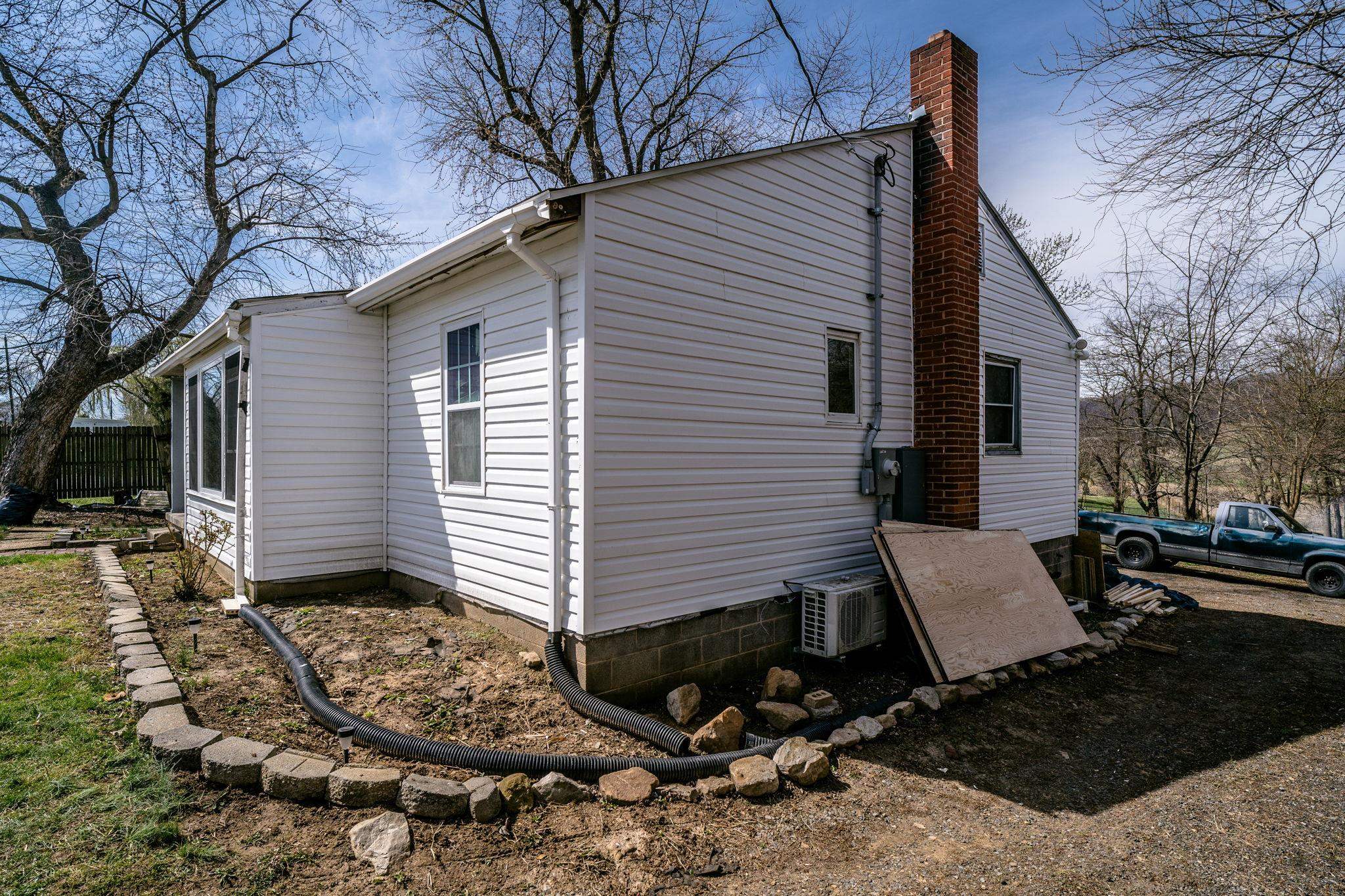 11147 Phillips Store Road Broadway, VA 22815 - Photo 17 of 22 a view of a house with backyard and trees