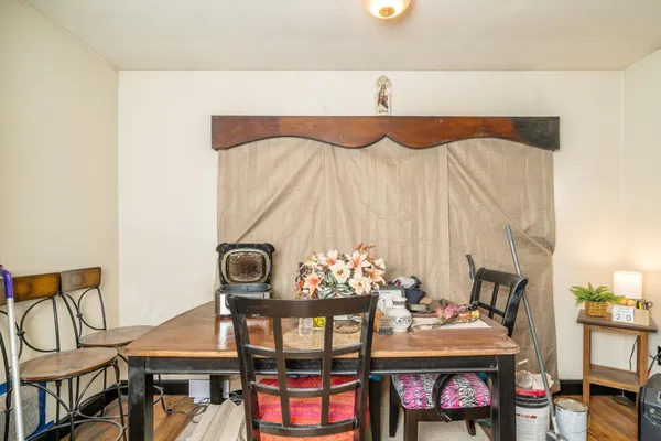 a view of walk in closet with wooden floor