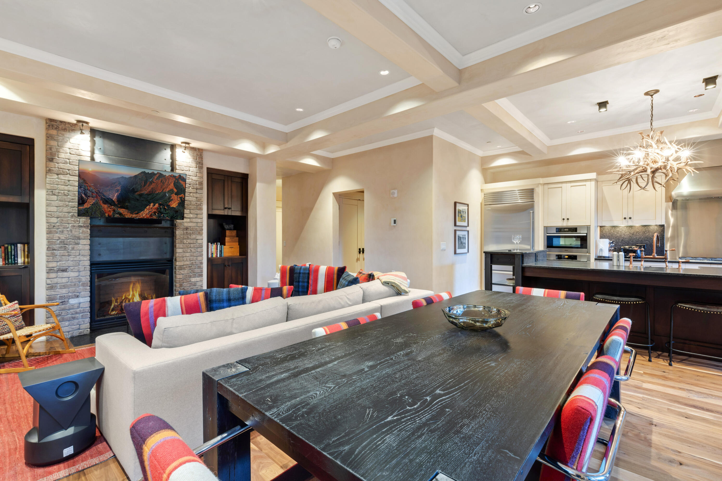 398 South Davis Street, Unit SW 201 Telluride, CO 81435 - Photo 9 of 23 a living room with fireplace furniture and a flat screen tv