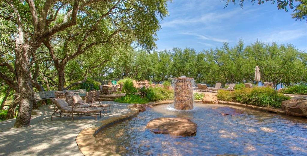 1015 Keechi Trail Graford, TX 76449 - Photo 8 of 13 a backyard of a house with table and chairs