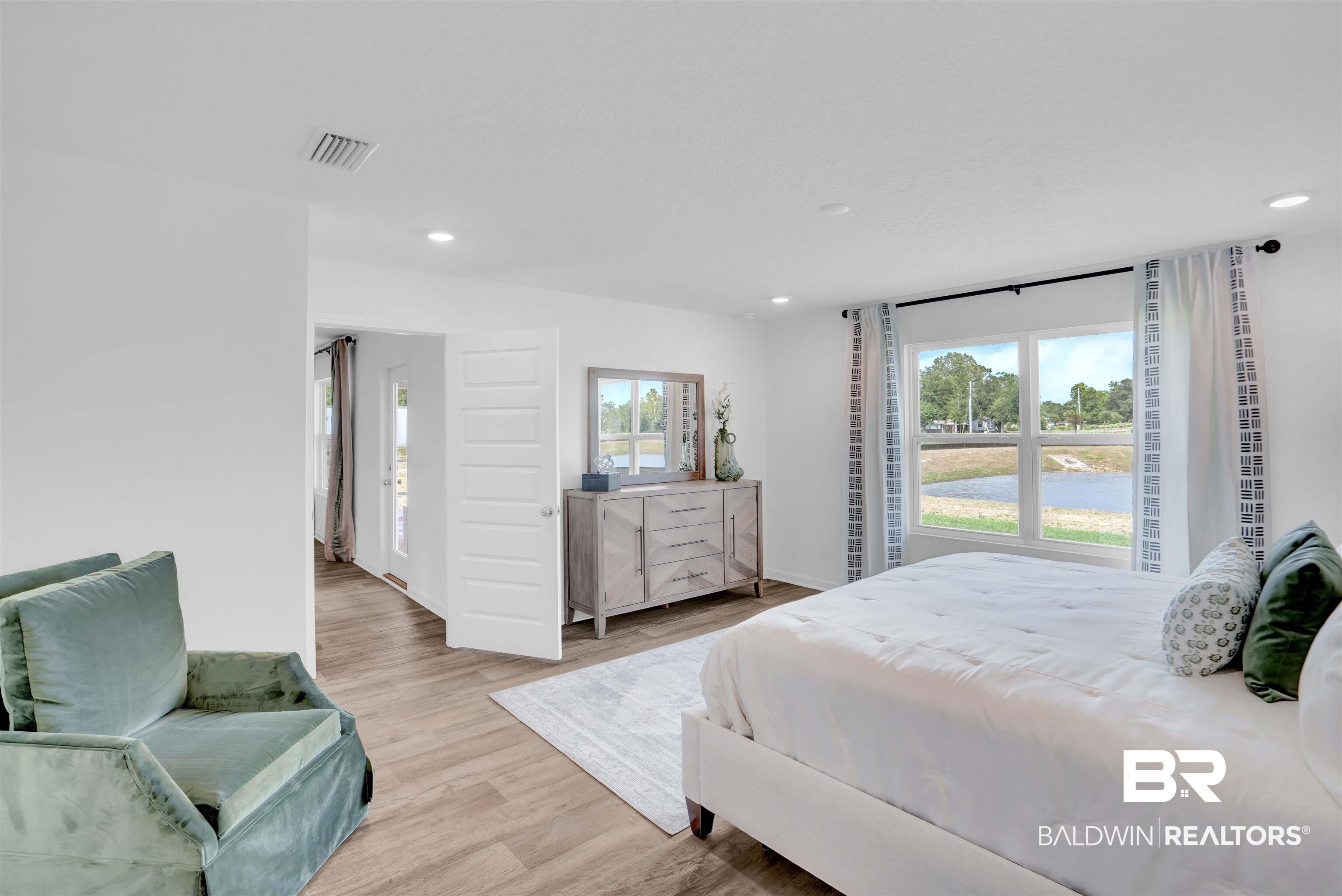 14717 Dayton Circle Foley, AL 36535 - Photo 25 of 39 Bedroom featuring light wood-type flooring and multiple windows