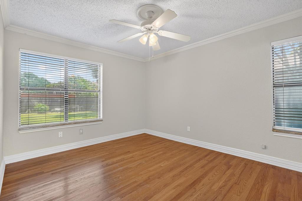 272 Lodge Road Coppell, TX 75019 - Photo 10 of 24 wooden floor in an empty room with a window
