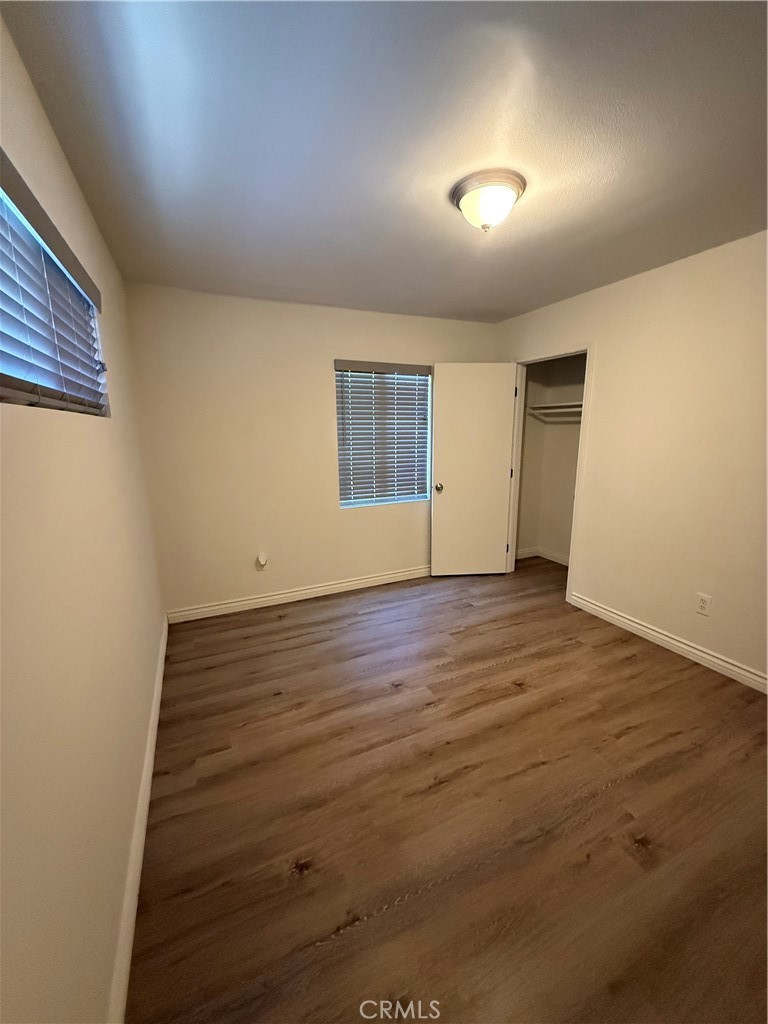455 East Wilson Street Rialto, CA 92376 - Photo 7 of 8 First bedroom with two windows and a closet.