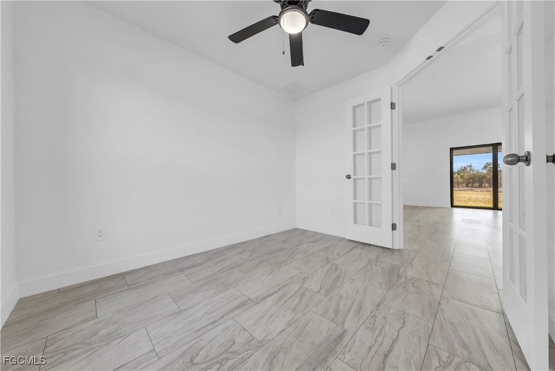 7979 16th Place LaBelle, FL 33935 - Photo 15 of 36 wooden floor in an empty room