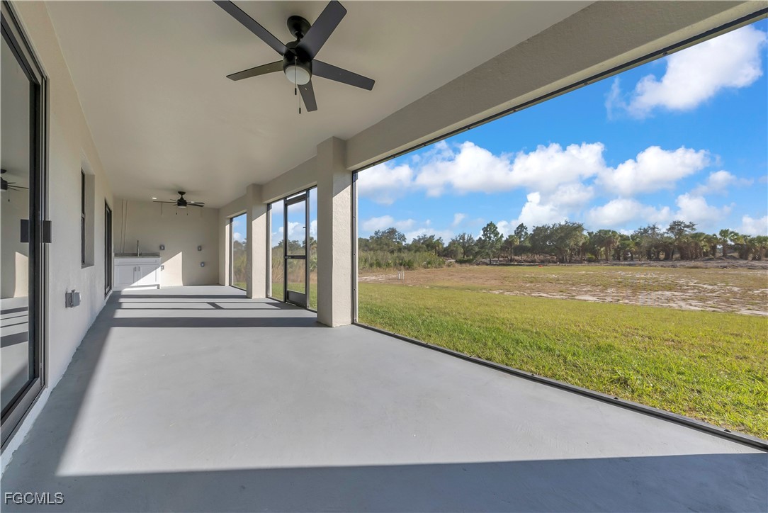 7979 16th Place LaBelle, FL 33935 - Photo 25 of 36 a view of a balcony with lake view and a floor to ceiling window