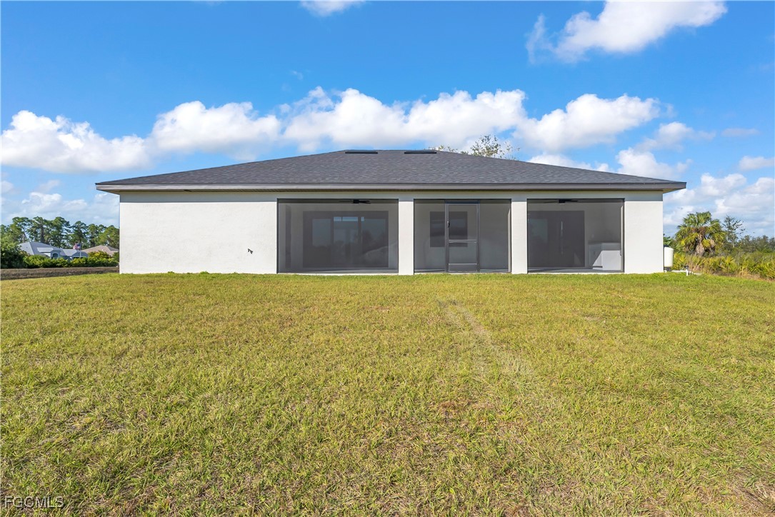7979 16th Place LaBelle, FL 33935 - Photo 28 of 36 a view of a house with backyard and garden