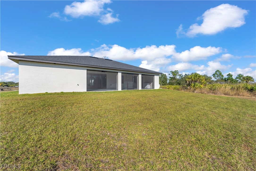 7979 16th Place LaBelle, FL 33935 - Photo 29 of 36 a view of a house with a yard