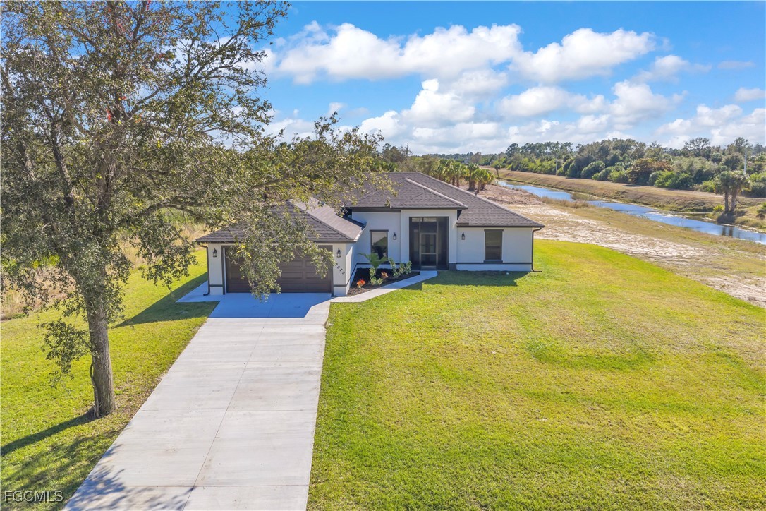 7979 16th Place LaBelle, FL 33935 - Photo 30 of 36 a house view with swimming pool in front of it