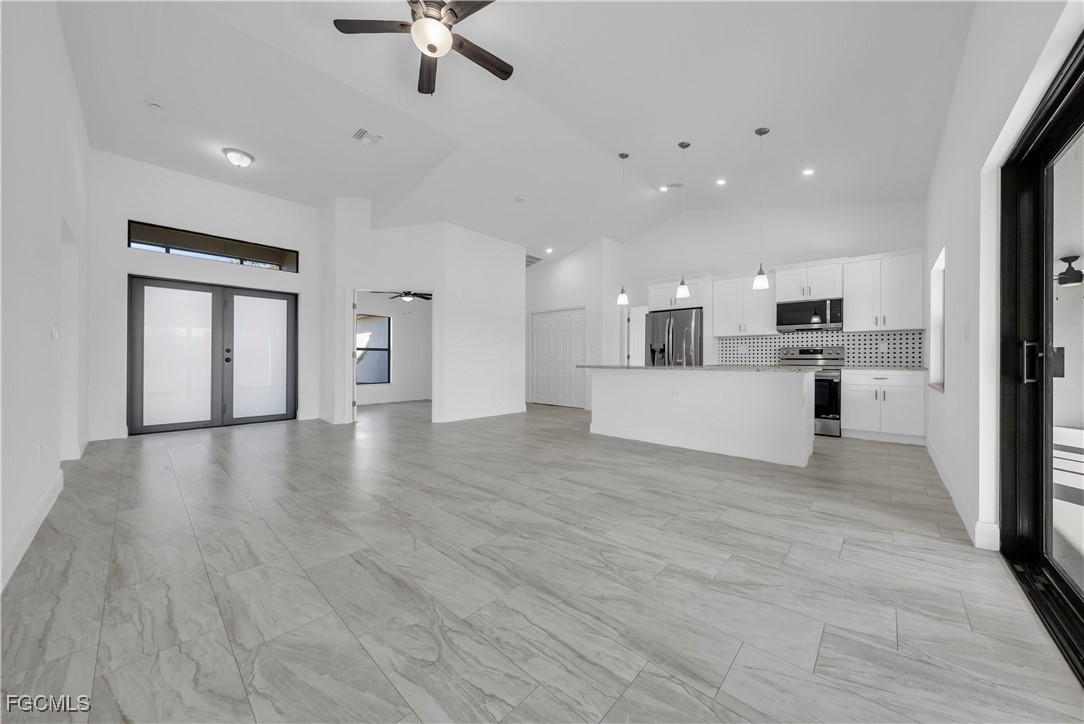 7979 16th Place LaBelle, FL 33935 - Photo 4 of 36 a view of a kitchen with a sink and a refrigerator