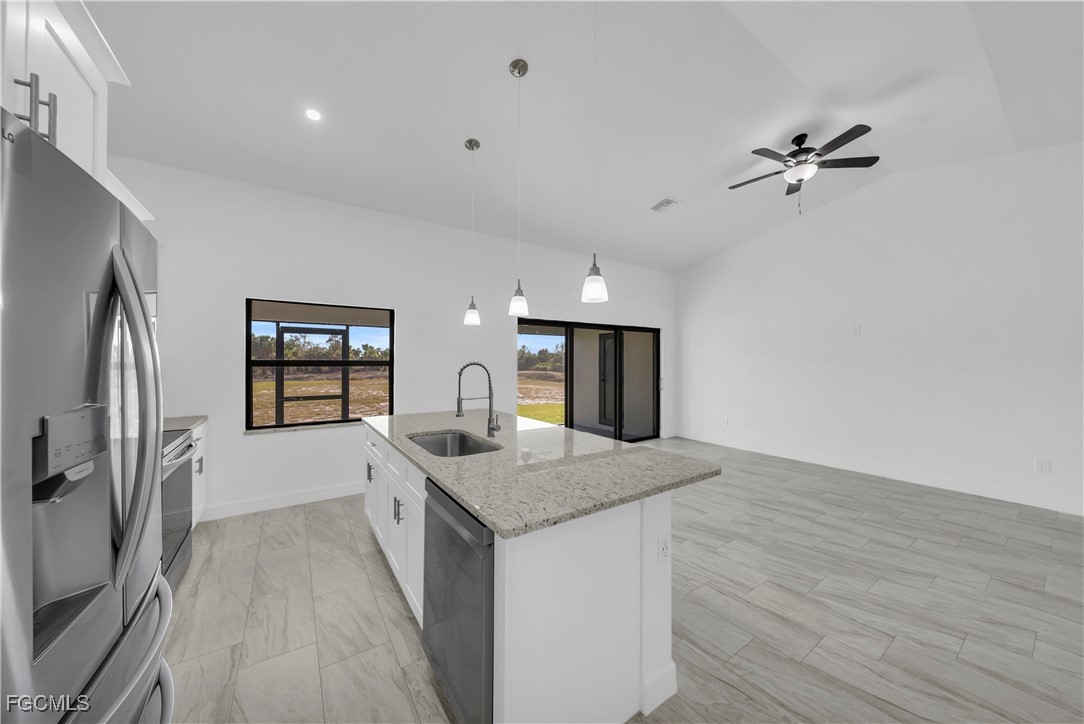 7979 16th Place LaBelle, FL 33935 - Photo 8 of 36 a view of a kitchen counter space a sink and wooden floor