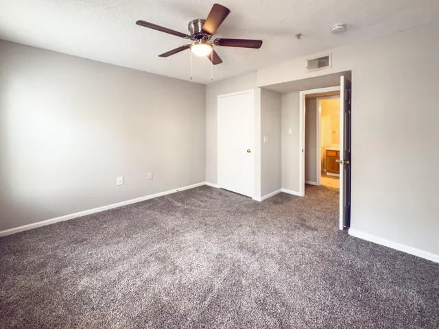 a view of a big room with carpet