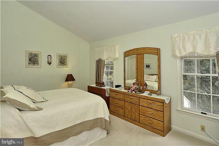 4232 Devonwood Way Woodbridge, VA 22192 - Photo 12 of 30 a bedroom with a bed and a large window