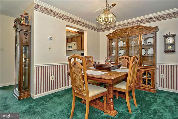 4232 Devonwood Way Woodbridge, VA 22192 - Photo 6 of 30 a view of a dining room with furniture and chandelier