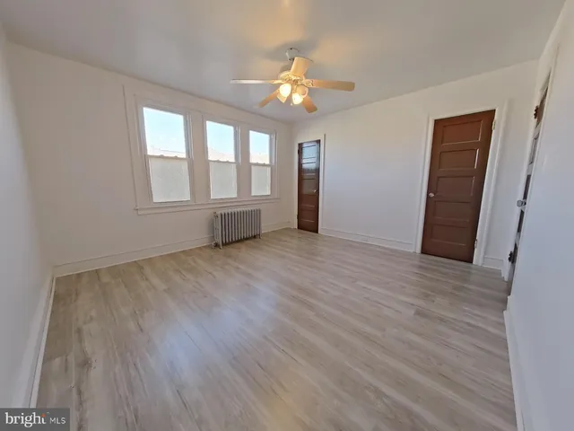 a view of livingroom with hardwood floor and hallway