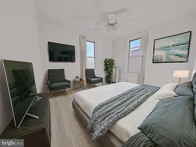 a bedroom with a bed and furniture