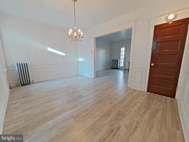 a view of a room with wooden floor and staircase