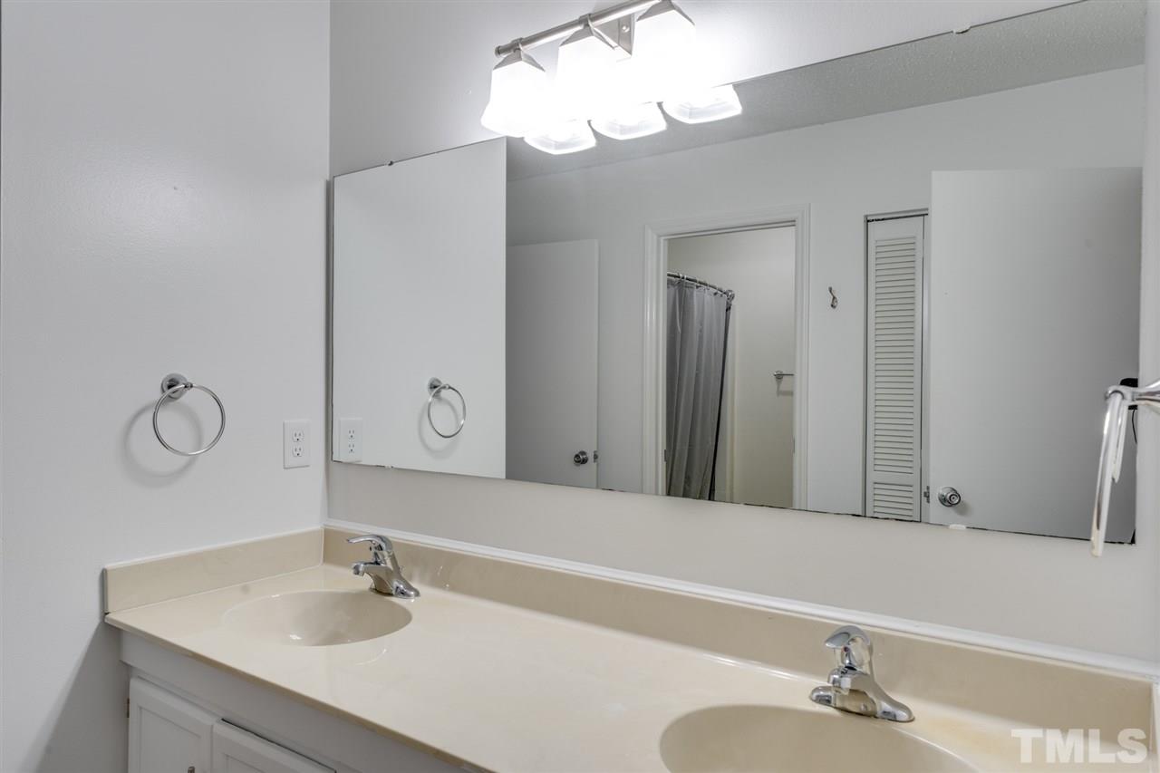 5757 3 Oaks Drive Raleigh, NC 27612 - Photo 13 of 20 a bathroom with a sink and a mirror