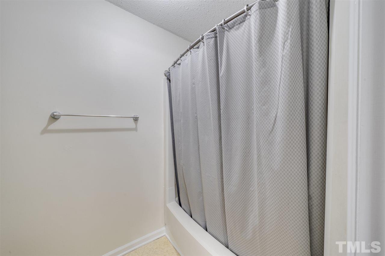 5757 3 Oaks Drive Raleigh, NC 27612 - Photo 15 of 20 a view of a bathroom with sink and shower