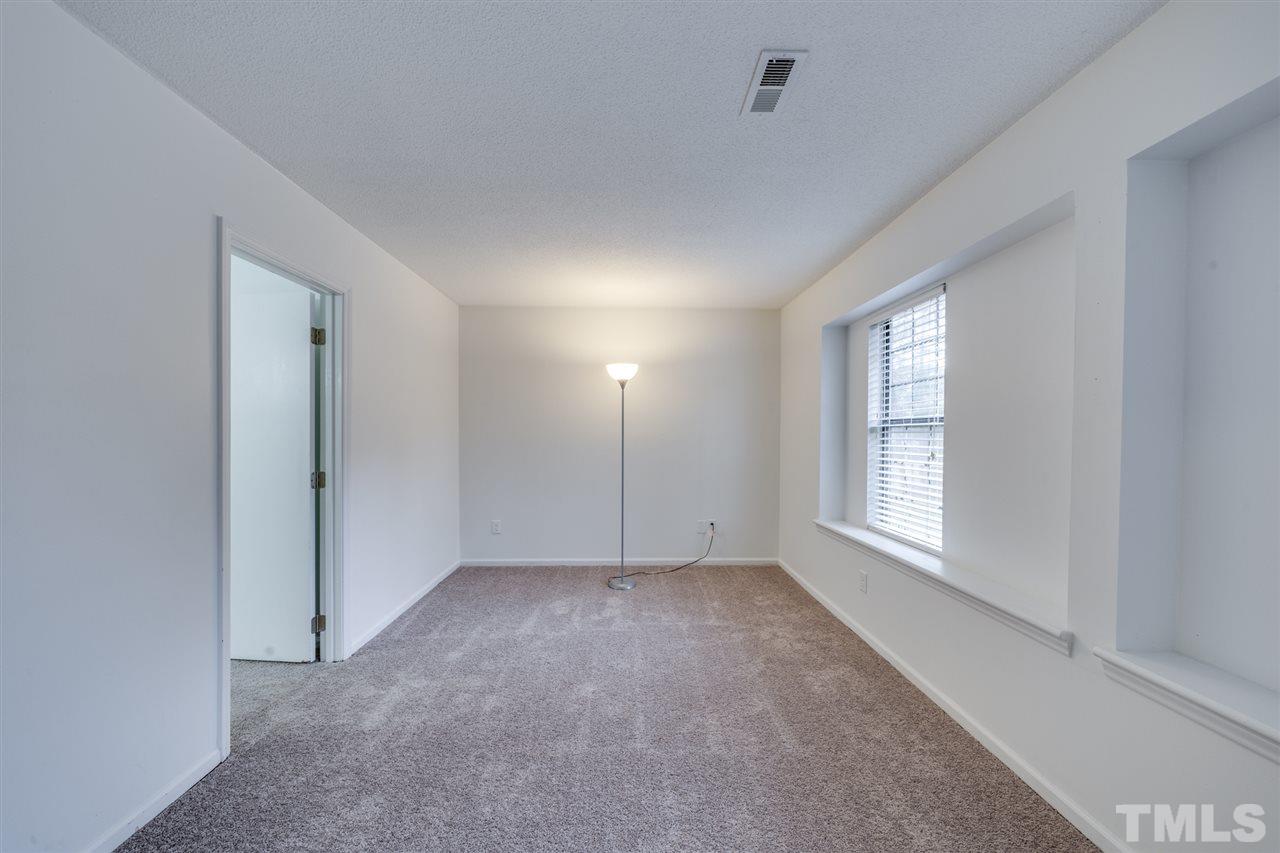 5757 3 Oaks Drive Raleigh, NC 27612 - Photo 16 of 20 a view of an empty room with a window