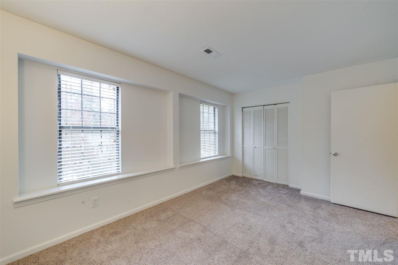 5757 3 Oaks Drive Raleigh, NC 27612 - Photo 17 of 20 a view of an empty room with a window