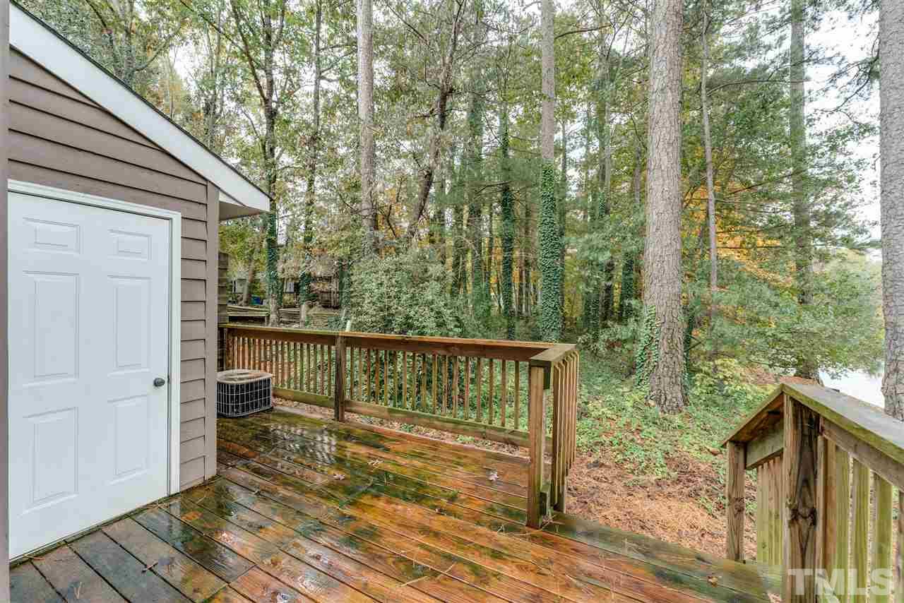 5757 3 Oaks Drive Raleigh, NC 27612 - Photo 20 of 20 a view of two chairs in a balcony
