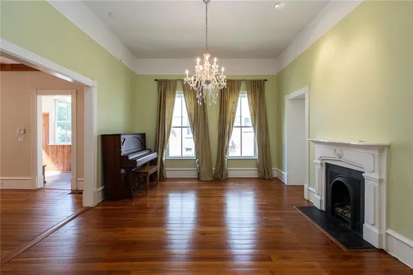 a kitchen with a sink window and cabinets
