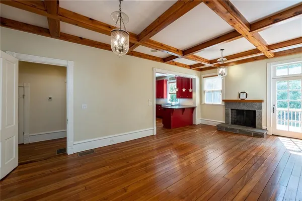 a kitchen view with a sink and large window