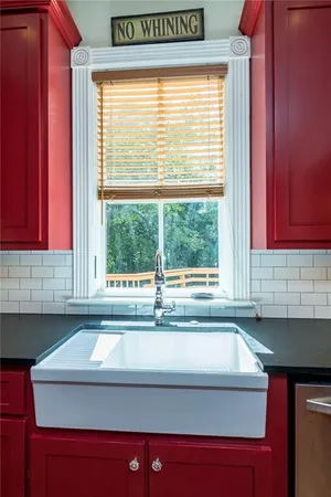 a view of a hallway view with wooden floor and staircase