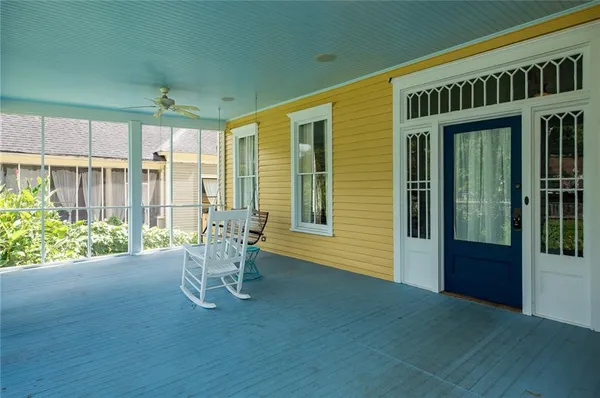 a view of an entryway with wooden floor