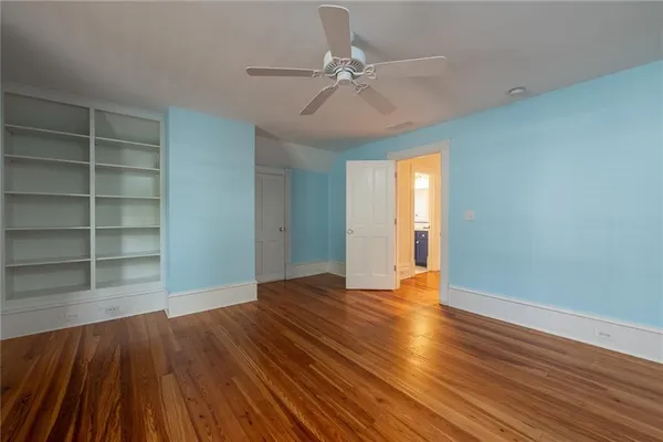 a view of a room with wooden floor